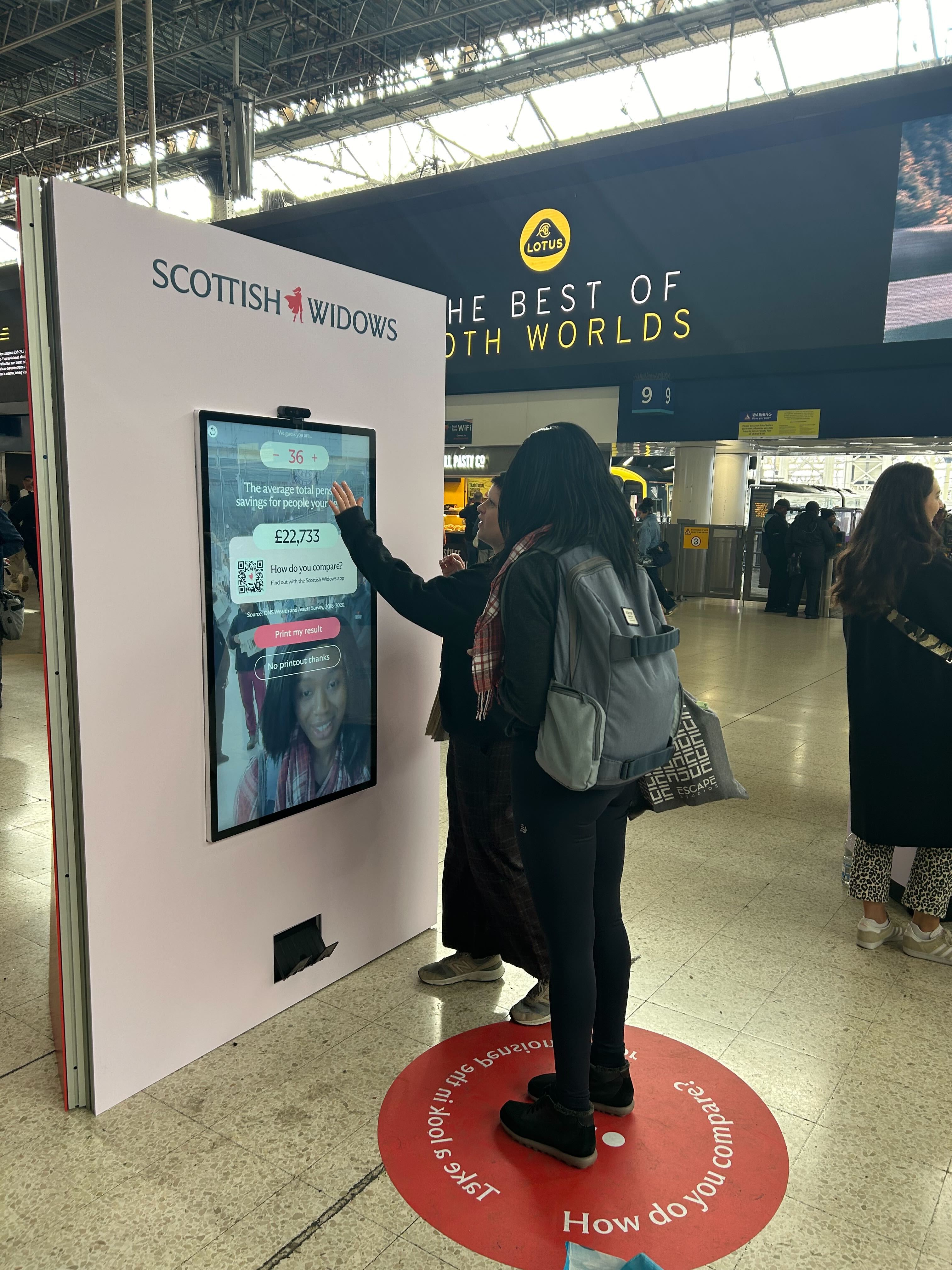 People using the real-life pension mirror touch screen