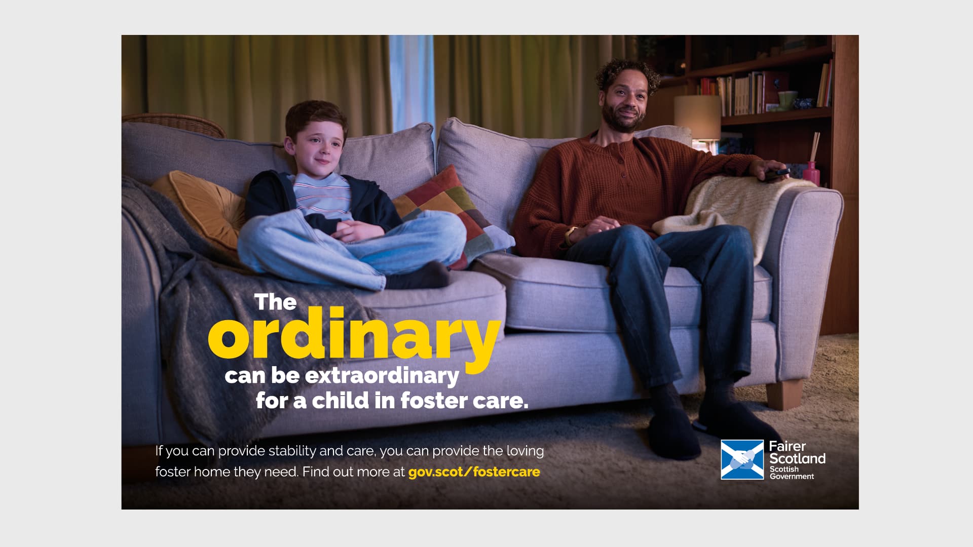 Press poster of a man and a boy sitting on a couch watching tv