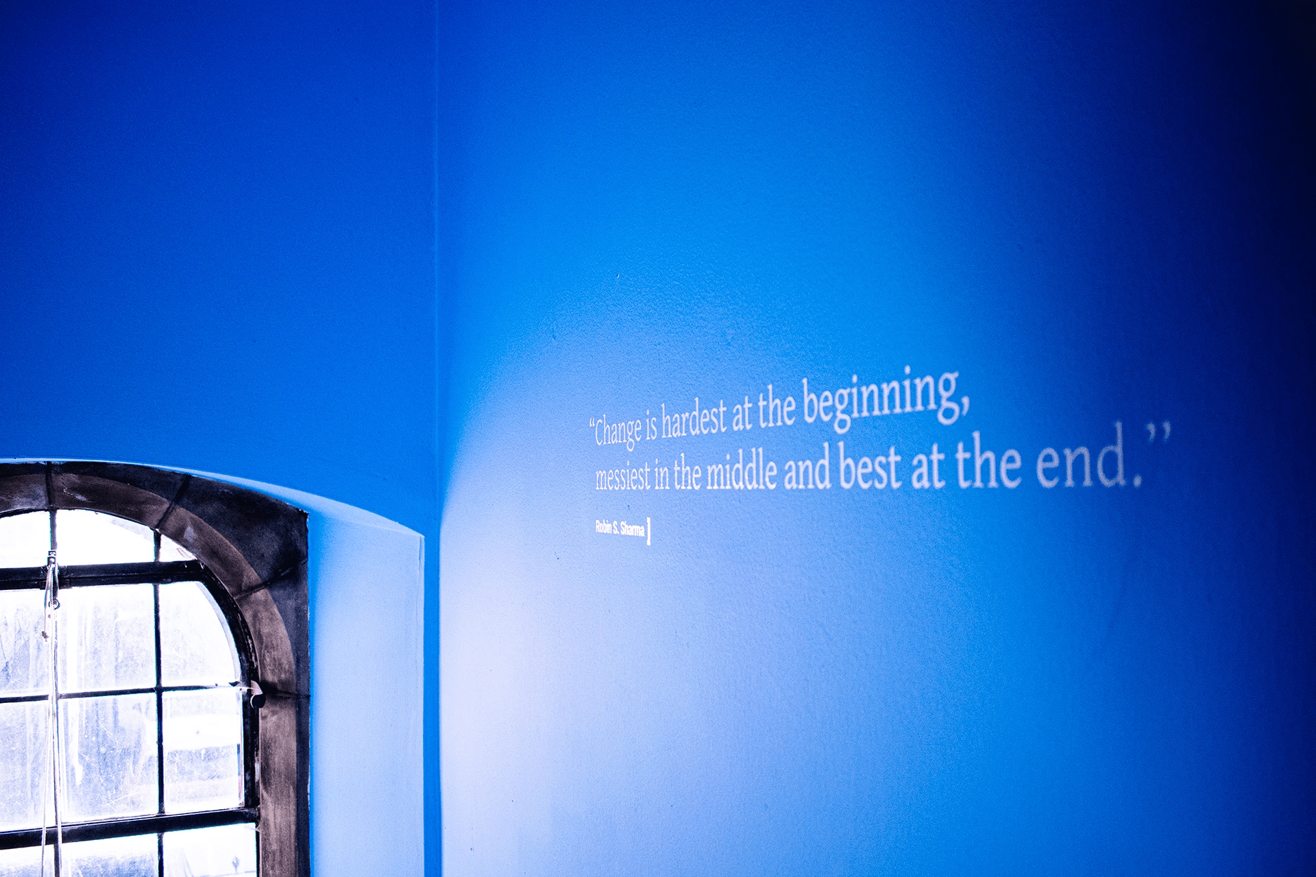 Quote on a wall "Change is the hardest at the beginning, messiest in the middle and best at the end." Robin S. Sharma