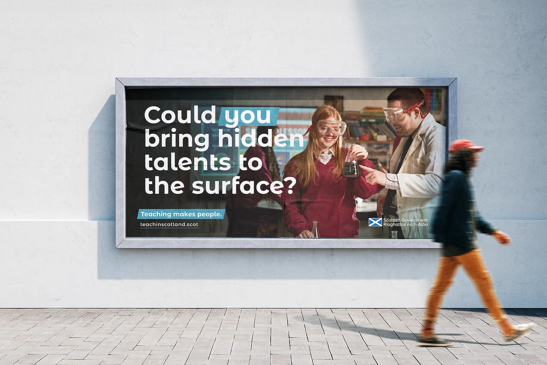 billboard mock up oid teachers ad with a man walking past